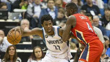 Apr 13, 2016; Minneapolis, MN, USA; Minnesota Timberwolves guard Andrew Wiggins (22) backs up to the basket against New Orleans Pelicans forward James Ennis (4) in the first half at Target Center. Mandatory Credit: Jesse Johnson-USA TODAY Sports