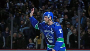 VANCOUVER, BC - MARCH 6: Alexander Edler #23 of the Vancouver Canucks waves to fans after scoring the overtime winning goal during their NHL game against the Toronto Maple Leafs at Rogers Arena March 6, 2019 in Vancouver, British Columbia, Canada. Vancouver won 3-2. (Photo by Jeff Vinnick/NHLI via Getty Images)