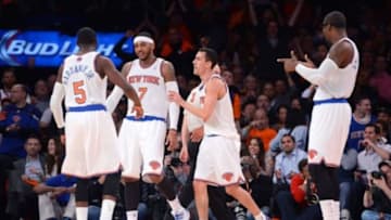 Apr 2, 2014; New York, NY, USA; New York Knicks forward Carmelo Anthony (7) celebrates a basket with teammates against the Brooklyn Nets during the first half at Madison Square Garden. Mandatory Credit: Joe Camporeale-USA TODAY Sports