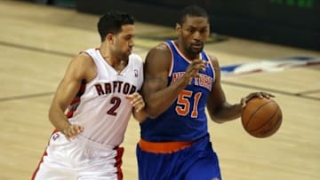 Oct 11, 2013; Toronto, Ontario, CAN; New York Knicks forward Metta World Peace (51) drives to the basket against Toronto Raptors forward Landry Fields (2) at Air Canada Centre. The Raptors beat the Knicks 100-91. Mandatory Credit: Tom Szczerbowski-USA TODAY Sports