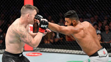 MELBOURNE, AUSTRALIA - OCTOBER 06: (R-L) Dhiego Lima of Brazil punches Luke Jumeau of New Zealand in their welterweight fight during the UFC 243 event at Marvel Stadium on October 06, 2019 in Melbourne, Australia. (Photo by Jeff Bottari/Zuffa LLC/Zuffa LLC via Getty Images)