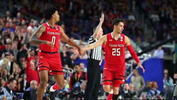 MINNEAPOLIS, MINNESOTA - APRIL 08: Kyler Edwards #0 and Davide Moretti #25 of the Texas Tech Red Raiders react against the Virginia Cavaliers in the first half during the 2019 NCAA men's Final Four National Championship game at U.S. Bank Stadium on April 08, 2019 in Minneapolis, Minnesota. (Photo by Tom Pennington/Getty Images)