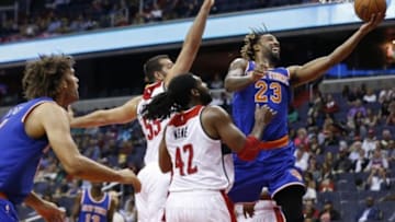Oct 9, 2015; Washington, DC, USA; New York Knicks forward Derrick Williams (23) shoots the ball as Washington Wizards center Josh Harrellson (55) defends in the second quarter at Verizon Center. Mandatory Credit: Geoff Burke-USA TODAY Sports