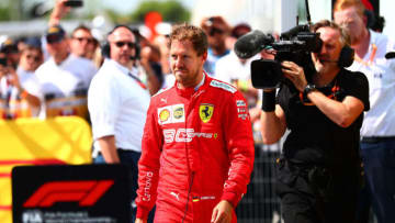 MONTREAL, QC - JUNE 09: Sebastian Vettel of Germany and Ferrari walks in to parc ferme to swap the 1st and 2nd place boards after the F1 Grand Prix of Canada at Circuit Gilles Villeneuve on June 9, 2019 in Montreal, Canada. (Photo by Dan Istitene/Getty Images)