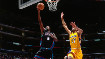 LOS ANGELES, CA - JAN 15: Michael Dickerson #8 of the Vancouver Grizzlies shoots against Rick Fox #17 of the Los Angeles Lakers on January 15, 2001 at Staples Center in Los Angeles, CA. NOTE TO USER: User expressly acknowledges and agrees that, by downloading and/or using this photograph, user is consenting to the terms and conditions of the Getty Images License Agreement. Mandatory Copyright Notice: Copyright 2001 NBAE (Photo by Robert Mora/NBAE via Getty Images)