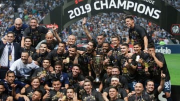 Monterrey players celebrate with the Concacaf Champions League trophy after beating the Tigres to win the 2019 title. The Rayados did not qualify for the 2020 tournament so there will be a new CCL champ. (Photo by Julio Cesar AGUILAR / AFP) (Photo credit should read JULIO CESAR AGUILAR/AFP via Getty Images)