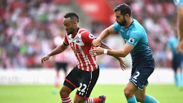 SOUTHAMPTON, ENGLAND - SEPTEMBER 18: Nathan Redmond of Southampton (L) takes the ball past Jordi Amat of Swansea City (R) during the Premier League match between Southampton and Swansea City at St Mary's Stadium on September 18, 2016 in Southampton, England. (Photo by Michael Regan/Getty Images)