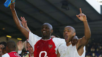 LONDON - APRIL 25: Thierry Henry and Patrick Vieira of Arsenal celebrates with team-mates at the end of the FA Barclaycard Premiership match between Tottenham Hotspur and Arsenal at White Hart Lane on April 25, 2004 in London. (Photo by Shaun Botterill/Getty Images)