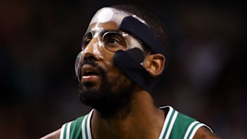 BOSTON, MA - NOVEMBER 16: Kyrie Irving #11 of the Boston Celtics, wearing a mask due to a facial fracture, looks on during the first quarter against the Golden State Warriors at TD Garden on November 16, 2017 in Boston, Massachusetts. (Photo by Maddie Meyer/Getty Images)