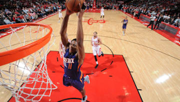 HOUSTON, TX - DECEMBER 26: Brandon Knight #11 of the Phoenix Suns dunks against the Houston Rockets during the game on December 26, 2016 at the Toyota Center in Houston, Texas. NOTE TO USER: User expressly acknowledges and agrees that, by downloading and or using this photograph, User is consenting to the terms and conditions of the Getty Images License Agreement. Mandatory Copyright Notice: Copyright 2016 NBAE (Photo by Bill Baptist/NBAE via Getty Images)