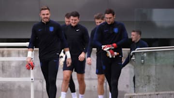 BURTON-UPON-TRENT, ENGLAND - SEPTEMBER 07: Jack Butland and Alex McCarthy of England walk onto the pitch ahead of an England training session at St Georges Park on September 7, 2018 in Burton-upon-Trent, England. (Photo by Laurence Griffiths/Getty Images)