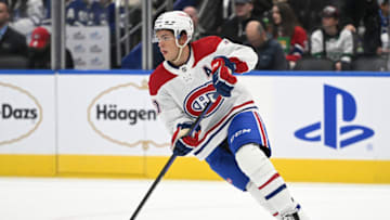 Sep 28, 2022; Toronto, Ontario, CAN; Montreal Canadiens forward Jake Evans (71) skates with the puck against the Toronto Maple Leafs in the first period at Scotiabank Arena. Mandatory Credit: Dan Hamilton-USA TODAY Sports