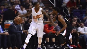 Apr 13, 2016; Phoenix, AZ, USA; Phoenix Suns guard Archie Goodwin (20) dribbles against Los Angeles Clippers guard C.J. Wilcox (30) at Talking Stick Resort Arena. The Suns won 114-105. Mandatory Credit: Joe Camporeale-USA TODAY Sports