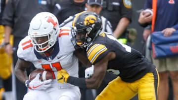 IOWA CITY, IOWA- OCTOBER 07: Wide receiver Mailk Turner #11 of the Illinois Fighting Illini is brought down by defensive back Josh Jackson #15 of the Iowa Hawkeyes during the second quarter on October 7, 2017 at Kinnick Stadium in Iowa City, Iowa. (Photo by Matthew Holst/Getty Images)