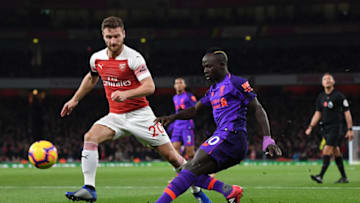 LONDON, ENGLAND - NOVEMBER 03: Shkodran Mustafi of Arsenal looks on as Sadio Mane of Liverpool shoots during the Premier League match between Arsenal FC and Liverpool FC at Emirates Stadium on November 3, 2018 in London, United Kingdom. (Photo by Michael Regan/Getty Images)