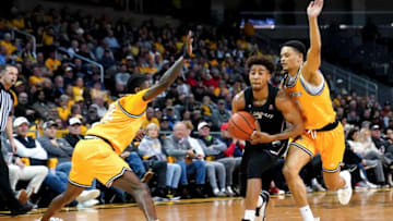 Cincinnati Bearcats guard Rob Phinisee drives to the basket against Northern Kentucky Norse. The Enquirer.
