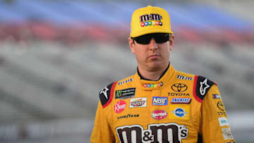 FORT WORTH, TX - NOVEMBER 02: Kyle Busch, driver of the #18 M&M's Toyota, walks on the grid during qualifying for the Monster Energy NASCAR Cup Series AAA Texas 500 at Texas Motor Speedway on November 2, 2018 in Fort Worth, Texas. (Photo by Jared C. Tilton/Getty Images)