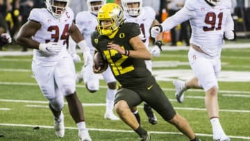 Nov 7, 2020; Eugene, Oregon, USA; Oregon Ducks quarterback Tyler Shough (12) scores a touchdown during the second half against the Stanford Cardinals at Autzen Stadium. The Oregon Ducks won 35-14. Mandatory Credit: Troy Wayrynen-USA TODAY Sports