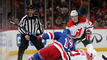 NEWARK, NJ - JANUARY 31: Jesper Fast #17 of the New York Rangers falls on Kyle Palmieri #21 of the New Jersey Devils during the third period at the Prudential Center on January 31, 2019 in Newark, New Jersey. The Rangers defeated the Devils 4-3. (Photo by Andy Marlin/NHLI via Getty Images)