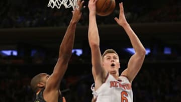Oct 29, 2015; New York, NY, USA; New York Knicks forward Kristaps Porzingis (6) shoots over Atlanta Hawks forward Al Horford (15) during the first half of an NBA basketball game at Madison Square Garden. Mandatory Credit: Adam Hunger-USA TODAY Sports