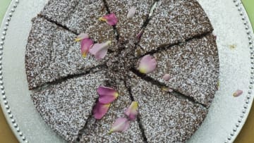 IRELAND - JUNE 05: Home-baked chocolate cake with rose petals on sale at farmers' market, County Clare, West of Ireland (Photo by Tim Graham/Getty Images)