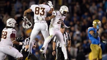 Nov 23, 2013; Pasadena, CA, USA; Arizona State Sun Devils wide receiver Alante Wright (83) and Arizona State Sun Devils wide receiver Jaelen Strong (21) celebrate as time runs out in the Sun Devils win over the UCLA Bruins at Rose Bowl. Mandatory Credit: Robert Hanashiro-USA TODAY Sports