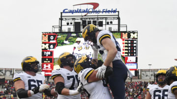 Nov 20, 2021; College Park, Maryland, USA; Michigan Wolverines tight end Luke Schoonmaker (86) celebrates with teammates after scoring a during the first half against the Maryland Terrapins at Capital One Field at Maryland Stadium. Mandatory Credit: Tommy Gilligan-USA TODAY Sports