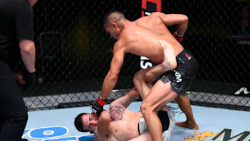 LAS VEGAS, NEVADA - SEPTEMBER 19: (R-L) Tyson Nam punches Jerome Rivera in their bantamweight bout during the UFC Fight Night event at UFC APEX on September 19, 2020 in Las Vegas, Nevada. (Photo by Chris Unger/Zuffa LLC)