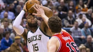 Apr 3, 2016; Milwaukee, WI, USA; Milwaukee Bucks center Greg Monroe (15) shoots against Chicago Bulls center Pau Gasol (16) during the third quarter at BMO Harris Bradley Center. Mandatory Credit: Jeff Hanisch-USA TODAY Sports