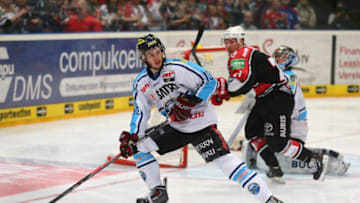 COLOGNE, GERMANY - APRIL 25: Ziga Jeglic of Ingolstadt skates with the puck against the Koelner Haie in game five of the DEL final play-offs between Koelner Haie and ERC Ingolstadt at Lanxess Arena on April 25, 2014 in Cologne, Germany. (Photo by Martin Rose/Bongarts/Getty Images)