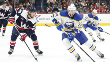 Mar 15, 2023; Washington, District of Columbia, USA; Buffalo Sabres left wing Zemgus Girgensons (28) skates with the puck as Washington Capitals defenseman Rasmus Sandin (38) defends in the second period at Capital One Arena. Mandatory Credit: Geoff Burke-USA TODAY Sports