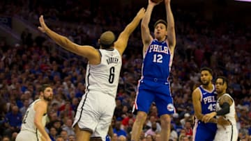 PHILADELPHIA, PA - APRIL 23: T.J. McConnell #12 of the Philadelphia 76ers shoots the ball against Jared Dudley #6 of the Brooklyn Nets in Game Five of Round One of the 2019 NBA Playoffs at the Wells Fargo Center on April 23, 2019 in Philadelphia, Pennsylvania. NOTE TO USER: User expressly acknowledges and agrees that, by downloading and or using this photograph, User is consenting to the terms and conditions of the Getty Images License Agreement. (Photo by Mitchell Leff/Getty Images)