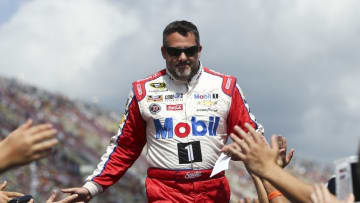 Aug 28, 2016; Brooklyn, MI, USA; Sprint Cup Series driver Tony Stewart (14) greets fans during driver introductions prior to the Pure Michigan 400 at the Michigan International Speedway. Mandatory Credit: Aaron Doster-USA TODAY Sports