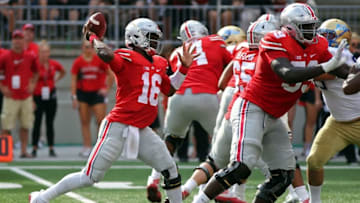 Sep 10, 2016; Columbus, OH, USA; Ohio State Buckeyes quarterback J.T. Barrett (16) looks to pass in the first half against the Tulsa Golden Hurricane at Ohio Stadium. Mandatory Credit: Aaron Doster-USA TODAY Sports