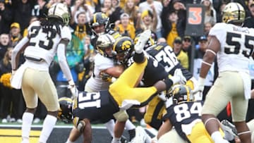 IOWA CITY, IOWA- OCTOBER 19: Running back Tyler Goodson #15 of the Iowa Hawkeyes dives over the line for a touchdown during the second half against the Purdue Boilermakers on October 19, 2019 at Kinnick Stadium in Iowa City, Iowa. (Photo by Matthew Holst/Getty Images)