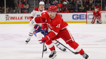DETROIT, MICHIGAN - FEBRUARY 26: Filip Zadina #11 of the Detroit Red Wings heads up ice in front of Paul Byron #41 of the Montreal Canadiens during the third period at Little Caesars Arena on February 26, 2019 in Detroit, Michigan. (Photo by Gregory Shamus/Getty Images)