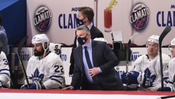MONTREAL, QC - FEBRUARY 10: Head coach of the Toronto Maple Leafs Sheldon Keefe looks on from the bench against the Montreal Canadiens during the third period at the Bell Centre on February 10, 2021 in Montreal, Canada. The Toronto Maple Leafs defeated the Montreal Canadiens 4-2. (Photo by Minas Panagiotakis/Getty Images)