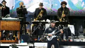 Apr 6, 2014; Dallas, TX, USA; Tom Morello plays guitar during the March Madness Music Festival with Bruce Springsteen (not pictured) and the E Street Band at Reunion Park. Mandatory Credit: Tim Heitman-USA TODAY Sports