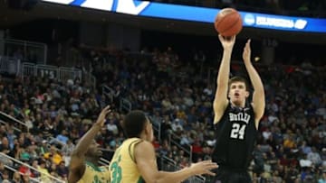 Mar 21, 2015; Pittsburgh, PA, USA; Butler Bulldogs guard Kellen Dunham (24) shoots the ball in front of Notre Dame Fighting Irish guard Jerian Grant (22) and Fighting Irish forward Bonzie Colson (35) during the first half in the third round of the 2015 NCAA Tournament at Consol Energy Center. Mandatory Credit: Charles LeClaire-USA TODAY Sports