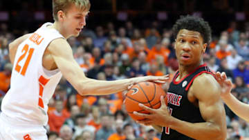 SYRACUSE, NY - FEBRUARY 20: Marek Dolezaj #21 of the Syracuse Orange reaches for the ball controlled by Dwayne Sutton #24 of the Louisville Cardinals during the first half at the Carrier Dome on February 20, 2019 in Syracuse, New York. Syracuse defeated Louisville 69-49. (Photo by Rich Barnes/Getty Images)