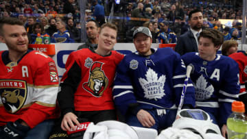 ST LOUIS, MISSOURI - JANUARY 24: (L-R) Jonathan Huberdeau #11 of the Florida Panthers, Brady Tkachuk #7 of the Ottawa Senators, Frederik Andersen #31 of the Toronto Maple Leafs and Mitch Marner #16 of the Toronto Maple Leafs sit on the bench during the 2020 NHL All-Star Skills Competition at Enterprise Center on January 24, 2020 in St Louis, Missouri. (Photo by Bruce Bennett/Getty Images)