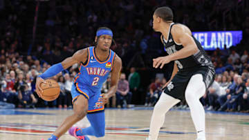 OKC Thunder guard Shai Gilgeous-Alexander (2) drives against San Antonio Spurs forward Keldon Johnson (3): Alonzo Adams-USA TODAY Sports