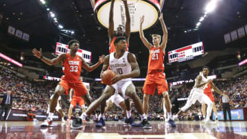 TALLAHASSEE, FL - FEBRUARY 15: Malik Osborne #10 of the Florida State Seminoles grabs a rebound over Elijah Hughes #33, Bourama Sidibe #34 and Marek Dolezaj #21 of the Syracuse Orange during the game at the Donald L. Tucker Center on February 15, 2020 in Tallahassee, Florida. Florida State defeated Syracuse 80 to 77. (Photo by Don Juan Moore/Getty Images)