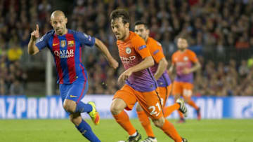 BARCELONA, SPAIN - OCTOBER 19 : Barcelona's Javier Mascherano (L) vies with Manchester's David Silva (R) during the UEFA Champions League match between FC Barcelona and Manchester City at Camp Nou Stadium in Barcelona, Spain on October 19, 2016. (Photo by Albert Llop/Anadolu Agency/Getty Images)