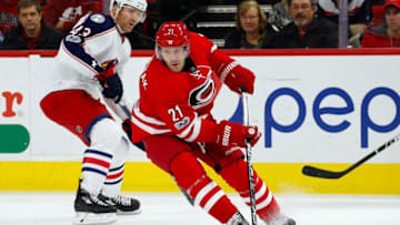Jan 10, 2017; Raleigh, NC, USA; Carolina Hurricanes forward Lee Stempniak (21) skates with the puck against the Columbus Blue Jackets at PNC Arena. The Carolina Hurricanes defeated the Columbus Blue Jackets 5-3. Mandatory Credit: James Guillory-USA TODAY Sports