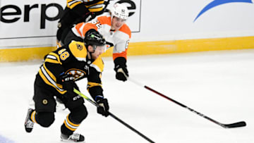 Jan 21, 2021; Boston, Massachusetts, USA; Boston Bruins defenseman Matt Grzelcyk (48) skates with the puck against Philadelphia Flyers right wing Nicolas Aube-Kubel (62) during the first period at the TD Garden. Mandatory Credit: Brian Fluharty-USA TODAY Sports