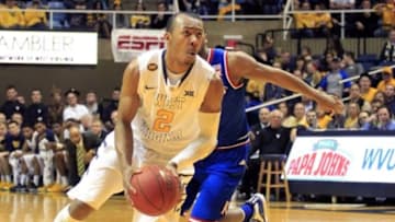 Feb 16, 2015; Morgantown, WV, USA; West Virginia Mountaineers guard Jevon Carter (2) drives to the basket against the Kansas Jayhawks during the first half at the WVU Coliseum. Mandatory Credit: Charles LeClaire-USA TODAY Sports