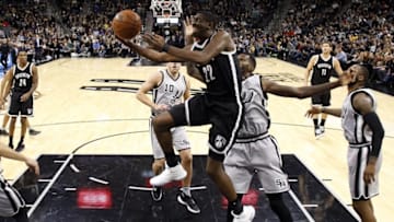 Dec 10, 2016; San Antonio, TX, USA; Brooklyn Nets shooting guard Caris LeVert (22) shoots the ball past San Antonio Spurs center Dewayne Dedmon (3, right) during the first half at AT&T Center. Mandatory Credit: Soobum Im-USA TODAY Sports