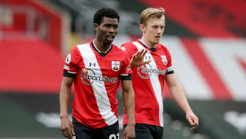 SOUTHAMPTON, ENGLAND - MARCH 14: Nathan Tella and James Ward-Prowse of Southampton during the Premier League match between Southampton and Brighton & Hove Albion at St Mary's Stadium on March 14, 2021 in Southampton, England. Sporting stadiums around the UK remain under strict restrictions due to the Coronavirus Pandemic as Government social distancing laws prohibit fans inside venues resulting in games being played behind closed doors. (Photo by Robin Jones/Getty Images)