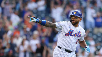 NEW YORK, NY - JUNE 25: Dominic Smith #2 of the New York Mets gestures to his teammates after he hit a game-winning walk off single in the eighth inning against the Philadelphia Phillies during game one of a doubleheader at Citi Field on June 25, 2021 in New York City. The Mets defeated the Phillies 2-1 (Photo by Rich Schultz/Getty Images)